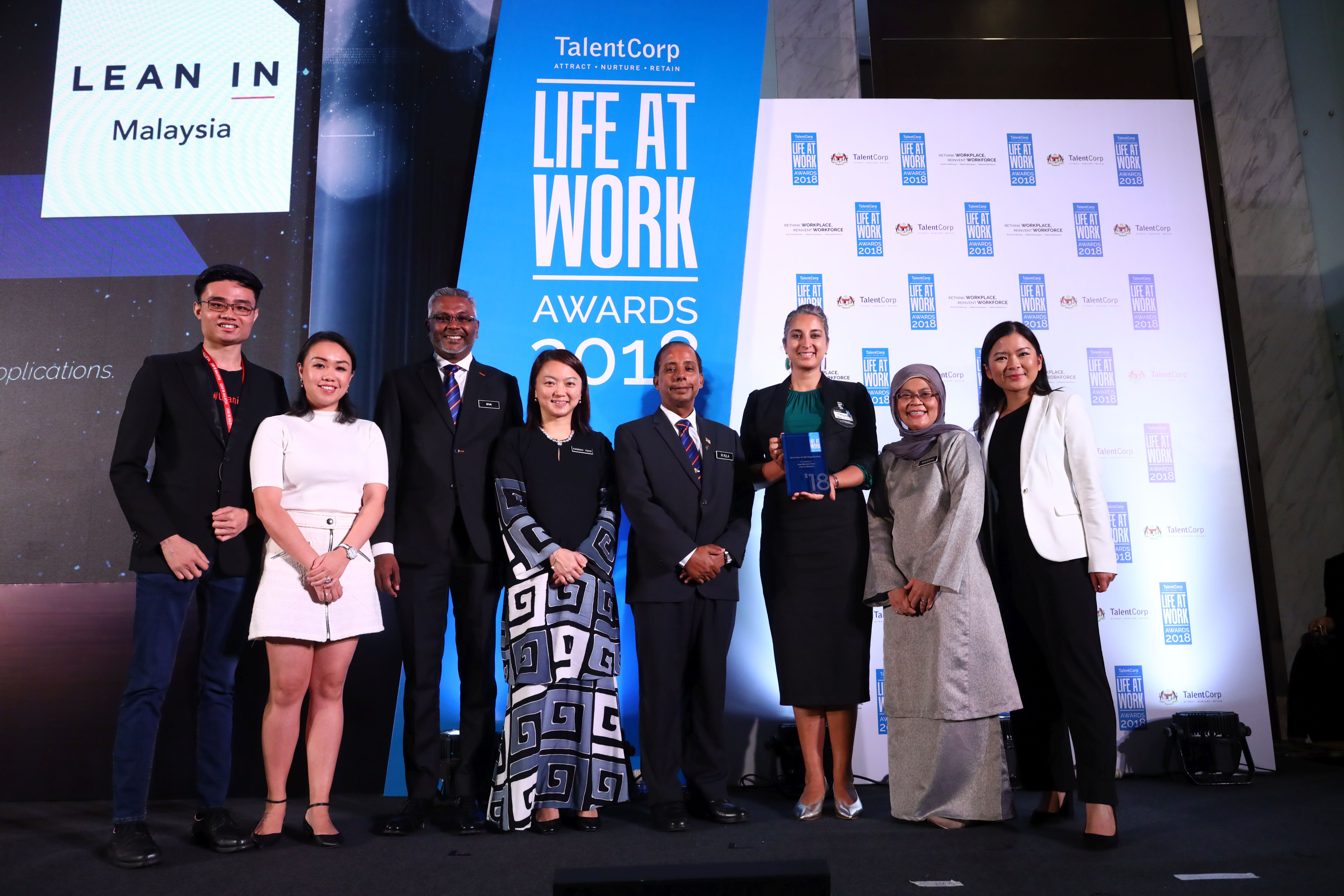 YB Hannah Yeoh at the LIFE AT WORK 2018 Awards. In a special message, Deputy Minister of Women, Family and Community Development YB Hannah Yeoh talks about the importance of having healthy and safe workplaces. This is a time of reckoning for Malaysia. We are making that difficult shift from developing nation to developed nation. Our families are facing the seemingly impossible challenge of juggling increased living costs, and their desire to grow safe and happy families. To further complicate matters, our existing workplace culture rewards long hours, appreciating output over outcomes. This makes it difficult for our citizens, whether men or women, young or old, single or married, to fulfil demands of work, family and life at the same time. The recently announced Budget 2019’s allocation of RM10 million to the Ministry of Women, Family and Community Development towards building 50 childcare facilities in civic buildings is just a first step. This move is a small milestone and we hope it will go a long way towards stopping abuse cases caused by childminders. As parents ourselves, we are at peace when our children are near us, safe with well-trained childcare providers. When we have peace, we work better, we are happier. And happy families make a happy and productive country. Of course, this New Malaysia with satisfied, productive citizens will not happen overnight. Together with the Ministry of Human Resources, my ministry will continue to grow and expand the impact of TalentCorp’s annual LIFE AT WORK Awards. This is the Government’s way of appreciating and celebrating progressive companies who are committed to embracing work-life practices for the benefit and wellbeing of their employees. I look forward to seeing more organisations in both the public and private sector stepping up to offer their employees the long-due support systems.