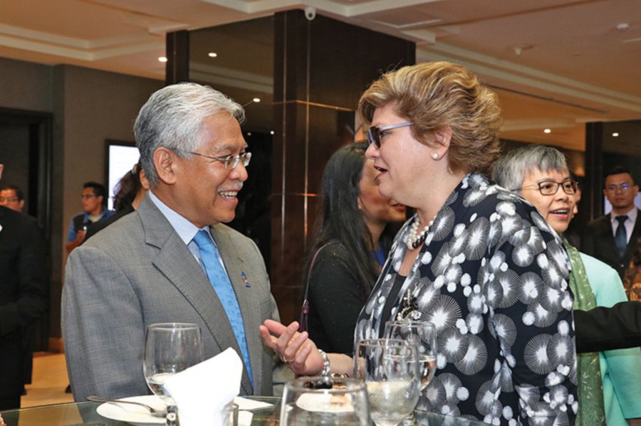 Idris Jusoh and Sarah Deverall sharing a light moment.